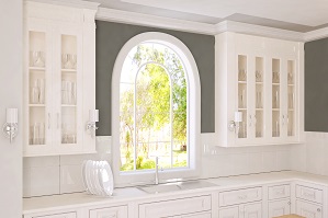 An arched window in a brightly lit home