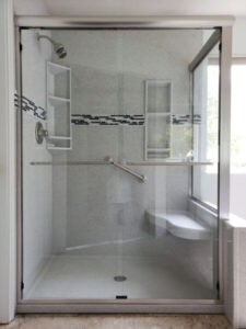 sleek and stylish shower with attractive backsplash and glass doors