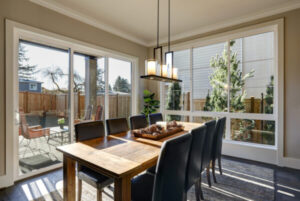 attractive dining room surrounded by gorgeous patio doors